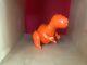 Brett Kern orange ceramic t-Rex dinosaur sculpture