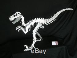 Dinosaur sculpture, Aluminum. 37 inches long. Raptor (Allosaurus, T-rex family)