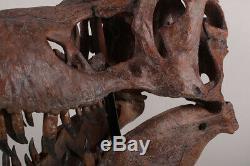 T-Rex Tyrannosaurus Dinosaur Giant skull fossil on stand